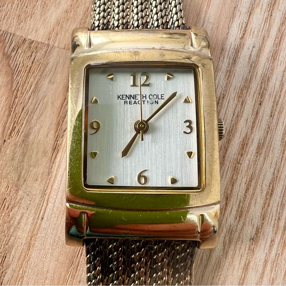 Kenneth Cole Reaction ladies rectangular gold tone dress watch NEW BATTERY